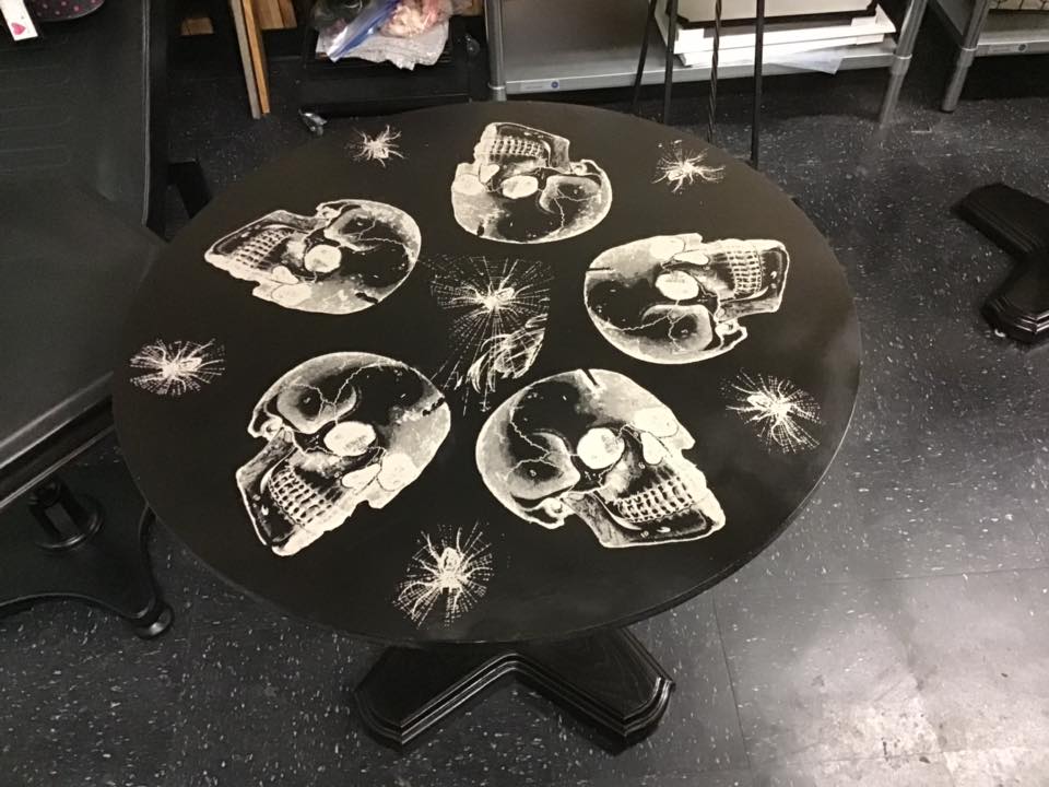 Halloween Chalk Couture Style victorian skulls chalked on a table 